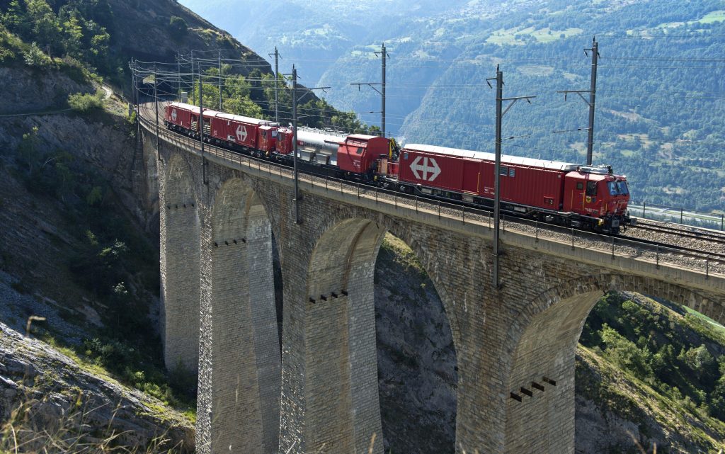 3CDDPHN Goods train of the Swiss railway company SBB crosses the Luogelkin Viaduct on the Loetschberg south ramp section near Hohtenn, Valais, Switzerland
